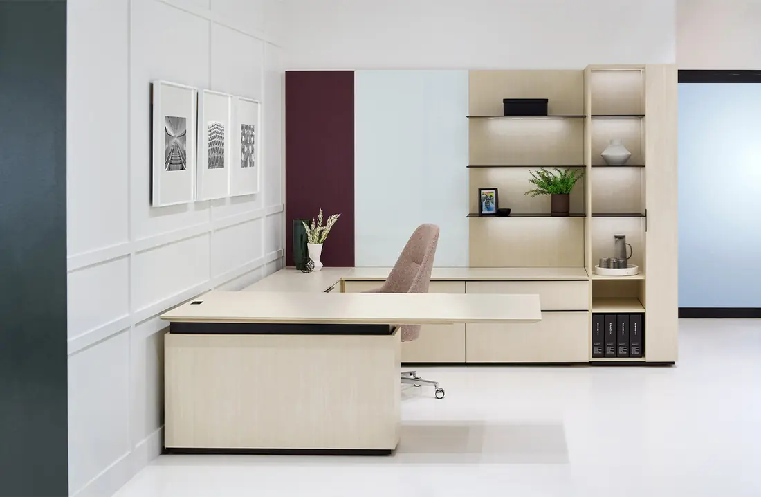 Enwork Affinity private office vignette in the PNB showroom, white casegoods with an oxblood accent wall